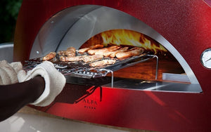 Great Outdoor Pizza Ovens food inserted into red Alfa Allegro outdoor wood-fired pizza oven