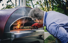 Stoking up the wood fire akes only 20 minutes to achieve ideal heating time in the ALFA 4 PIZZE outdoor pizza oven